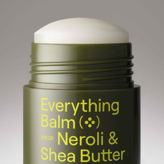 Stick of 'Everything Balm' with 'Neroli & Shea Butter' text on a gradient background