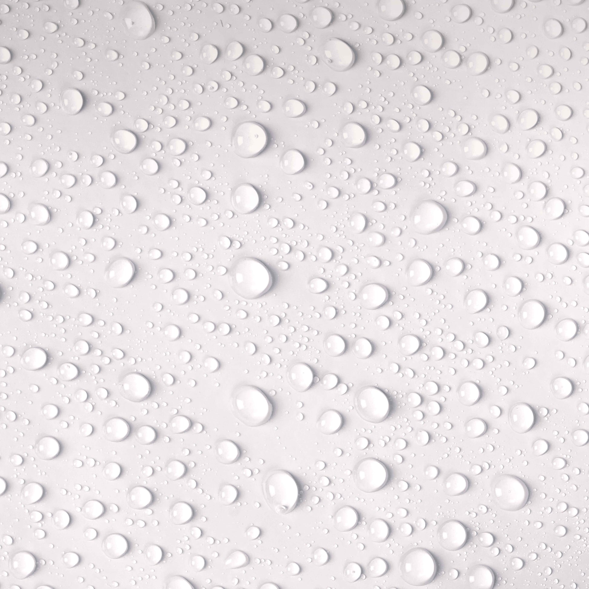 Pattern of water droplets on a white surface
